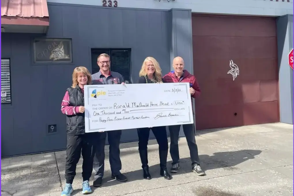 Happy Danes Auto Repair presenting a donation check