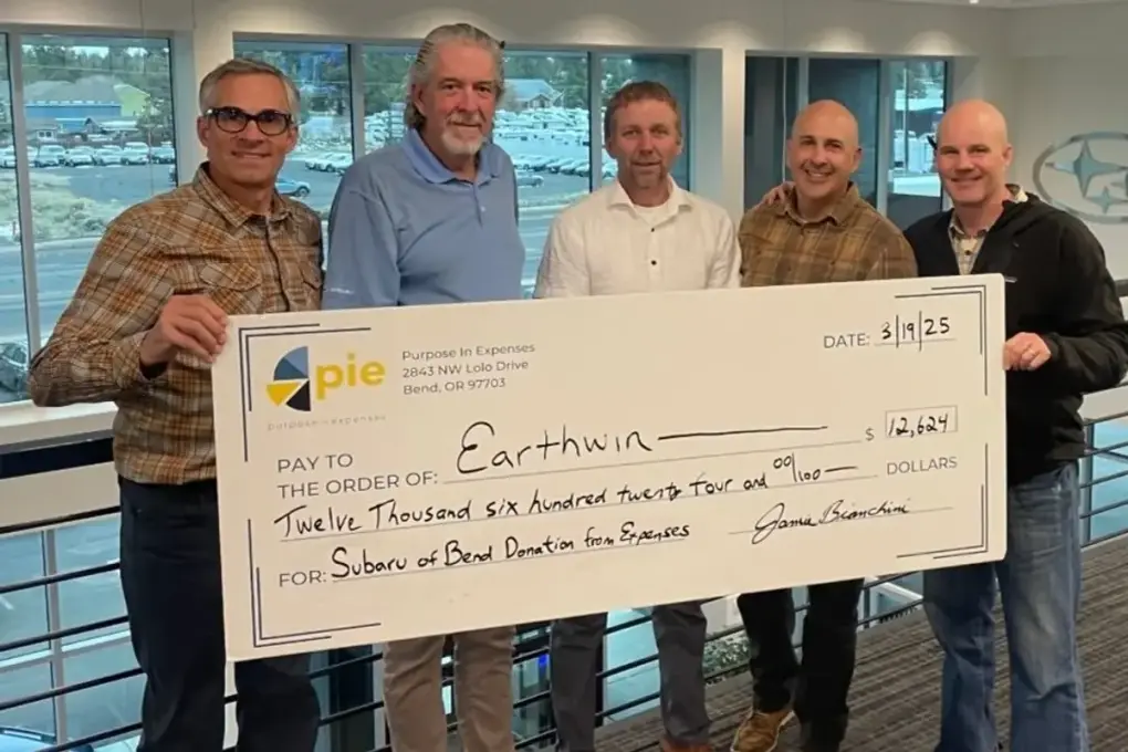 The Subaru of Bend team presenting a donation check